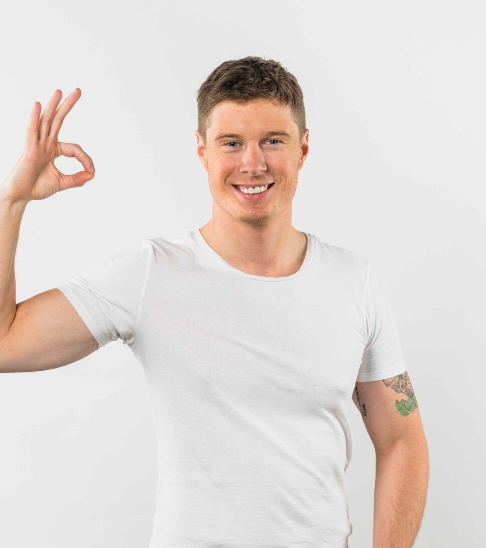 Happy man giving an OK sign after the ProGen weight-loss programme